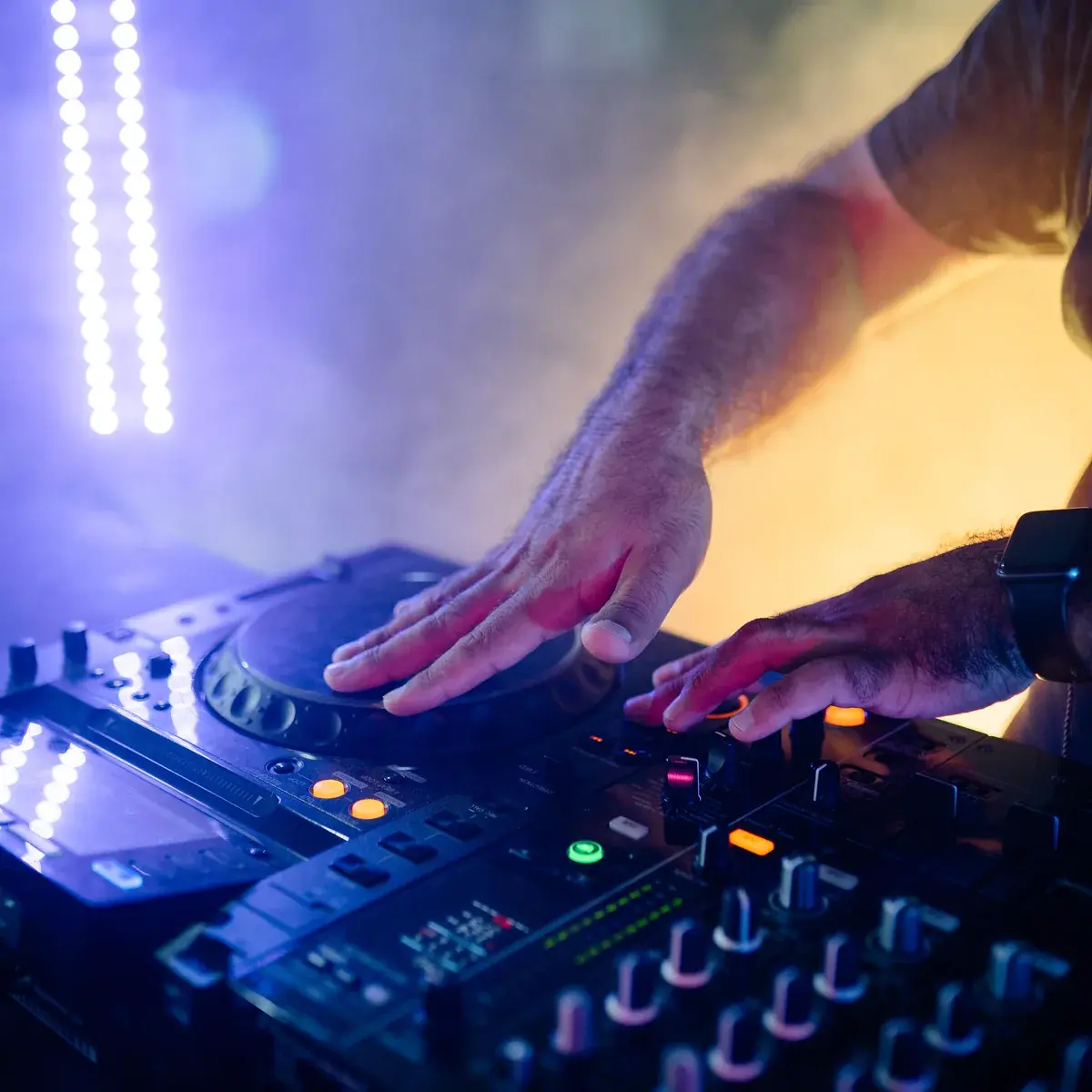 Close-up of a DJ mixing on professional CDJs