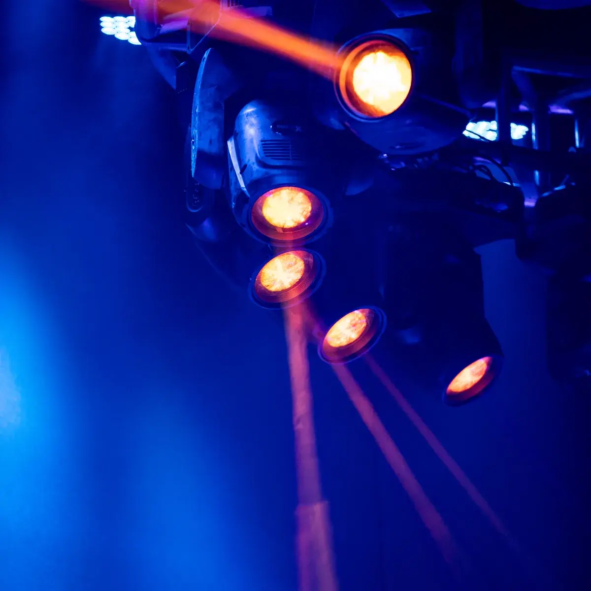 Moving-head lighting fixtures casting coloured beams