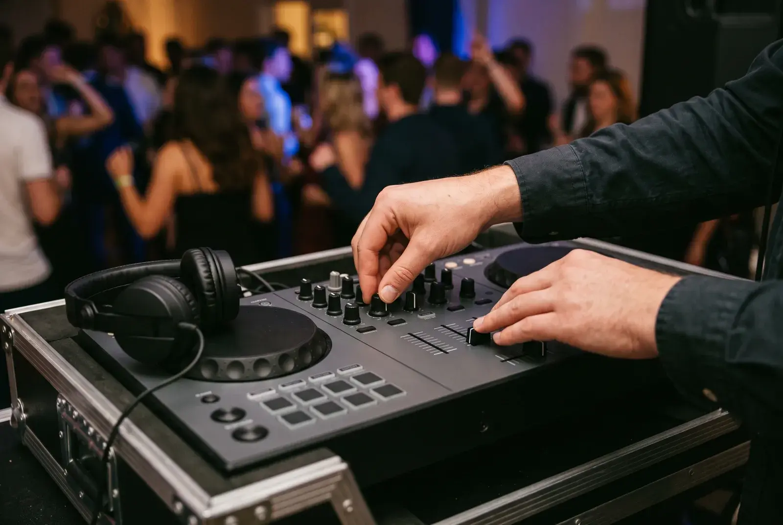 A DJ's hands working the controller at a Feel the Presha event