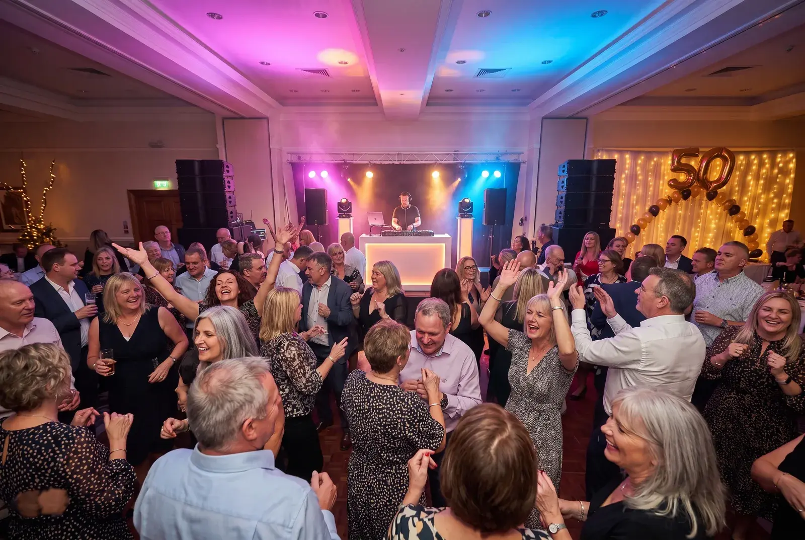 A lively 40th/50th birthday party dancefloor with Feel the Presha DJ booth